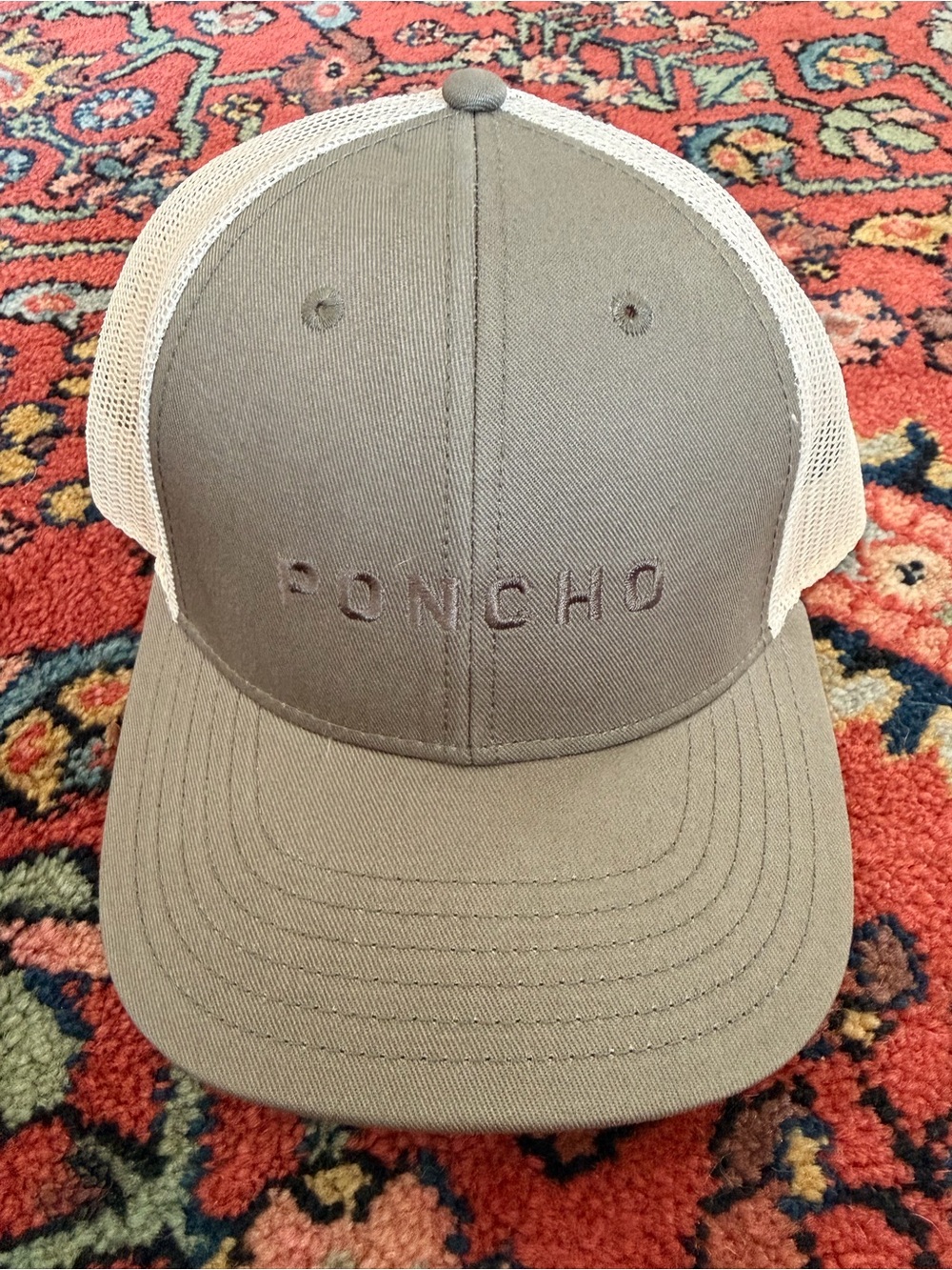 Poncho Outdoors Trucker Hat interior with mesh and label